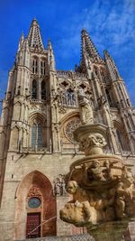 Low angle view of church against blue sky
