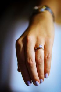 Close-up of woman showing wedding ring