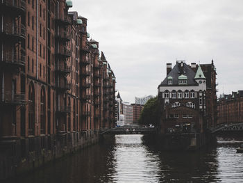 Canal passing through city buildings