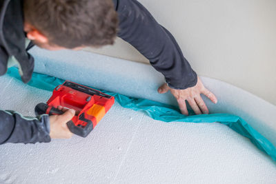 High angle view of man working at home