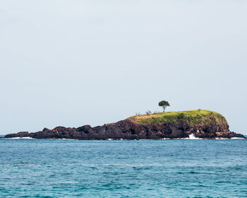 Island against clear sky