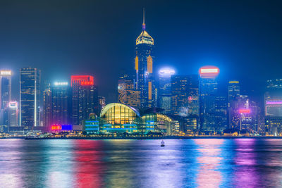 Illuminated buildings in city at night