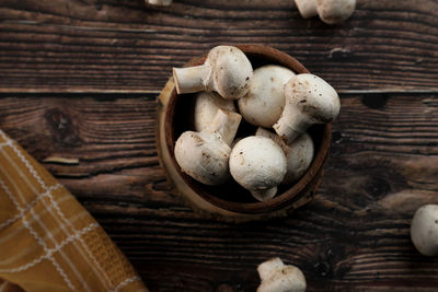 High angle view of mushrooms in basket on table