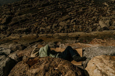 People relaxing on rock