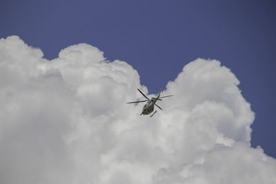 Low angle view of airplane flying in sky