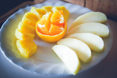 High angle view of orange slices in plate on table