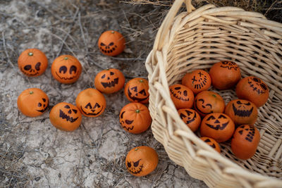 Healthy alternative to candy trick or treat snacks for kids on halloween--basket of mandarin oranges 