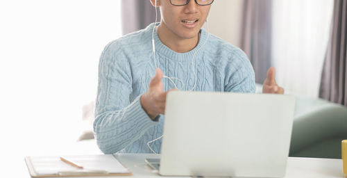 Mid adult man using mobile phone