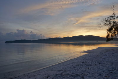 View of seascape against cloudy sky