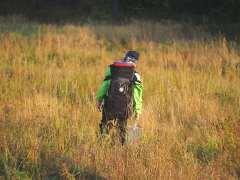 Rear view of man on field