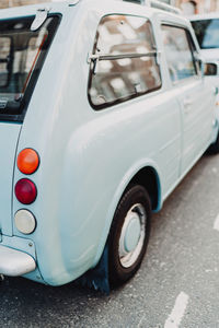 Close-up of vintage car on street