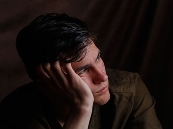 Serious sad young man thinking about problem. depression and anxiety disorder concept