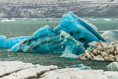 Scenic view of iceberg floating in sea