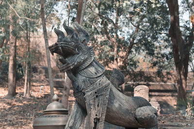 View of statues on tree trunk