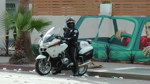 Man riding motor scooter