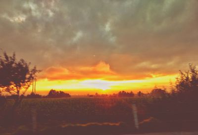Scenic view of dramatic sky during sunset