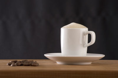 Close-up of coffee cup on table