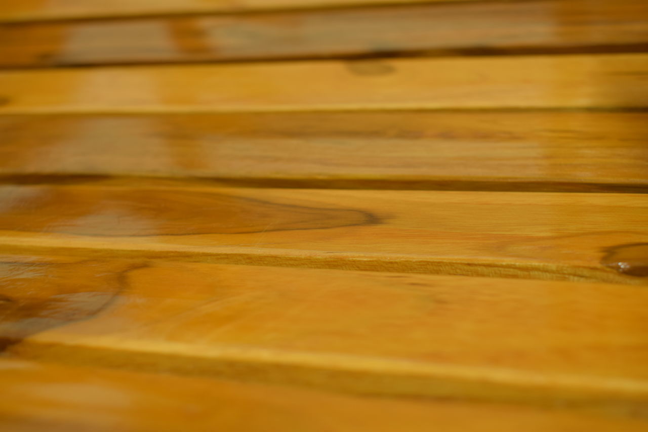 FULL FRAME SHOT OF WOOD WITH YELLOW WATER