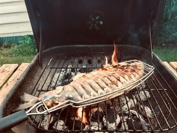 High angle view of meat on barbecue grill