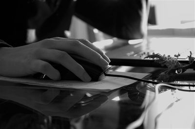 Midsection of woman working on table