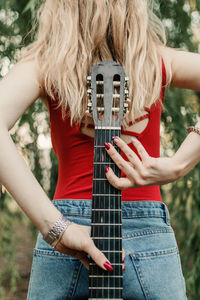 Creative hobbies, guitar lessons, playing musical instruments. acoustic guitars for beginners. young 