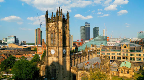 Buildings in city against sky