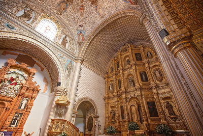 Low angle view of ornate ceiling in city