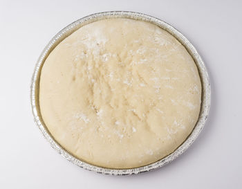 High angle view of ice cream in bowl against white background