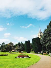 View of temple in park against cloudy sky