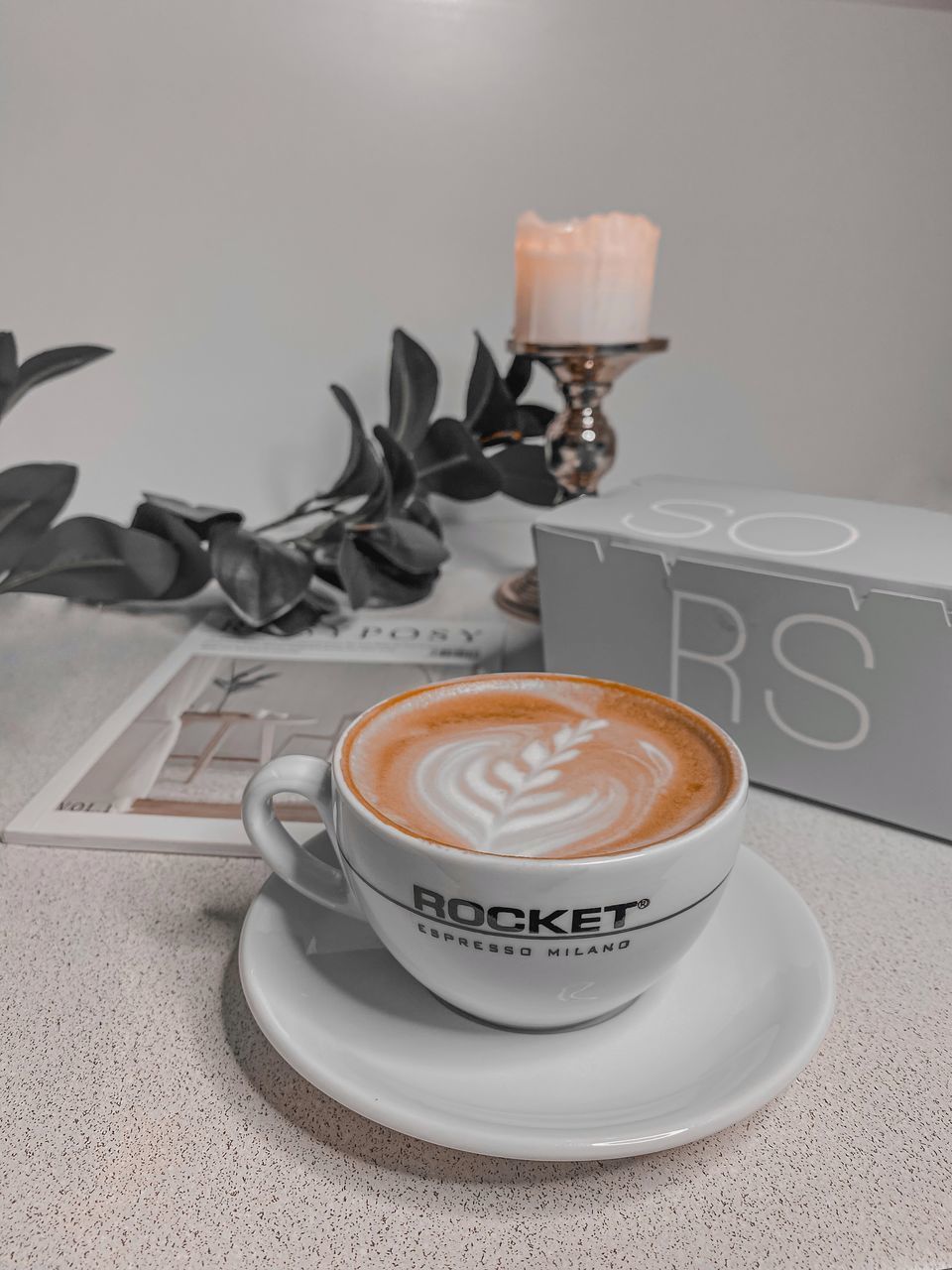 CLOSE-UP OF COFFEE CUP ON TABLE WITH SPOON