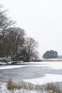 Scenic view of frozen lake against clear sky