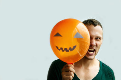 Halloween background with man making face