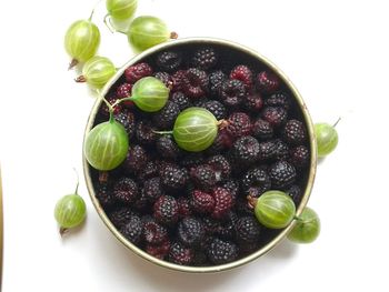 Close-up of fruit over white background