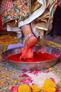 Low section of bride performing ritual