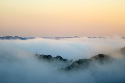 Scenic view of mountains against sky during sunset