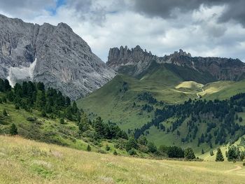 Scenic view of landscape and mountains against sky