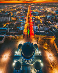 High angle view of illuminated buildings in city at night