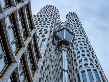 Low angle view of modern buildings against sky