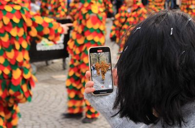 Rear view of woman using mobile phone