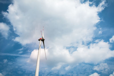 Low angle view of windmill against sky