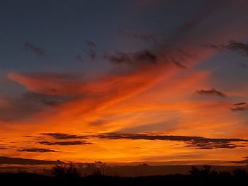 Low angle view of dramatic sky during sunset