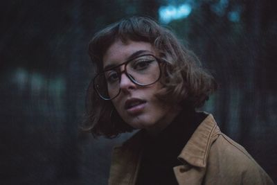 Close-up portrait of woman wearing eyeglasses