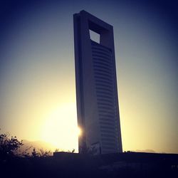 Low angle view of buildings at sunset