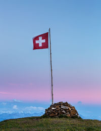 Red flag against sky