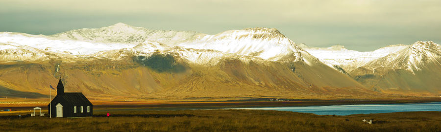 Scenic view of snowcapped mountains against sky