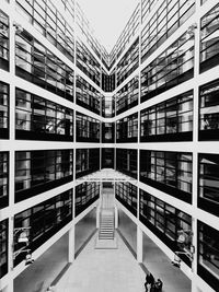 Low angle view of building seen through glass window