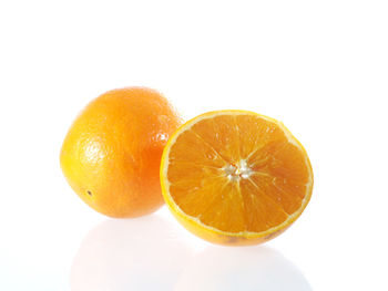 Close-up of fruit slices on white background