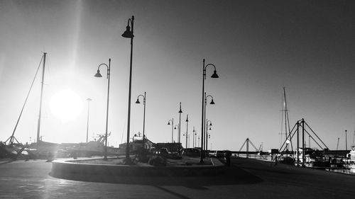 Sailboats in sea against clear sky