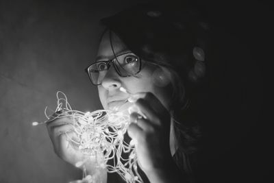 Close-up of young woman wearing eyeglasses