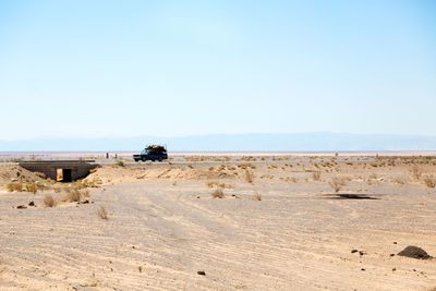 Scenic view of desert against clear sky